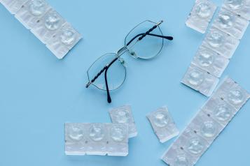 Photo of eyeglasses and contacts.