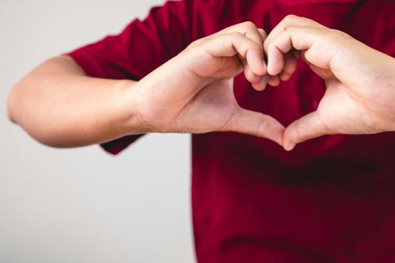 Hands in heart formation.